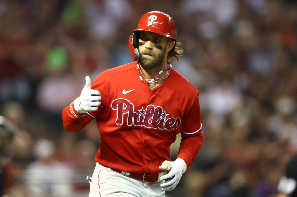 Bryce Harper rounds the bases after hitting a sixth-inning home run against the Diamondbacks in Game 5 of the NL Championship Series in Phoenix on Saturday.