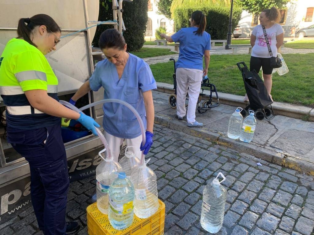 A water company employee fills bottles with potable water in Pozoblanco, Spain, in September 2023. The struggle for drinking water in this village of 18,000 has become a glimpse of what may lie ahead for parts of Europe where drought and extreme heat are on the rise. 