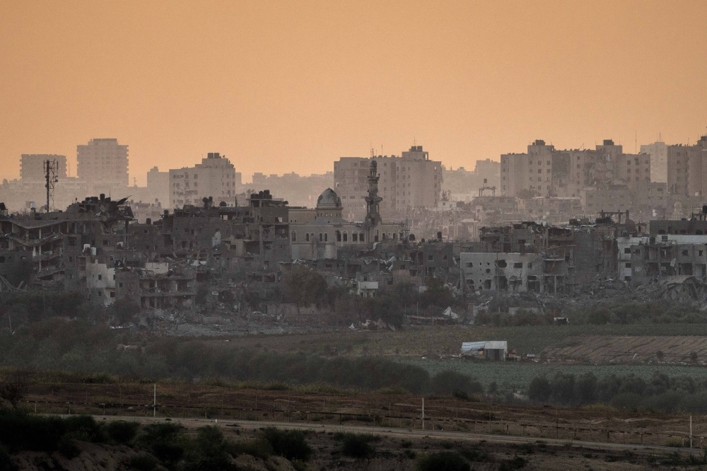 A view of destroyed houses in the Beit Hanoun district of Gaza Strip as seen from Sderot, Israel, on Saturday. 