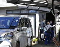 Police search the home of Tatsuya Yasuzumi in Kumagaya, Saitama Prefecture, on Sunday. | KYODO