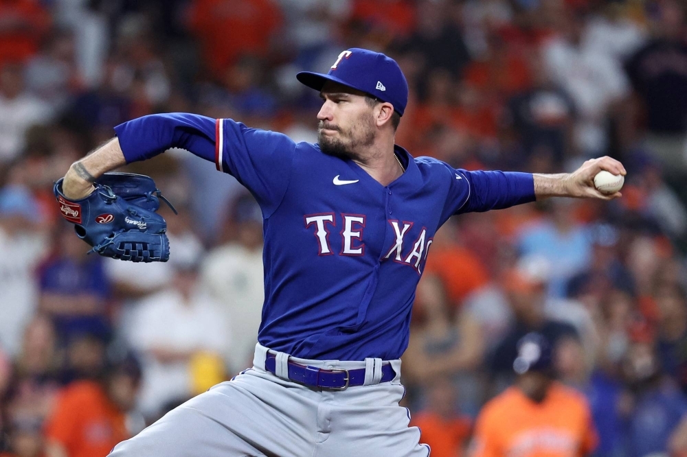 Rangers reliever Andrew Heaney pitches against the Astros during Game 6 of the ALCS in Houston on Sunday.