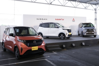 Nissan Motor Sakura electric vehicles (left and center), and a Mitsubishi Motors eK X electric vehicle on display during their release ceremony at the Mitsubishi Motors Mizushima plant in Kurashiki, Okayama Prefecture, in May 2022. 
