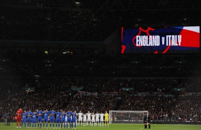 English and Italian footballers observe a minute of silence for the victims of a deadly shooting in Brussels and of the devastating events in Israel and Palestine, at Wembley Stadium in London on Oct. 17.