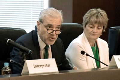 Gustavo Caruso (left), head of an International Atomic Energy Agency task force, speaks at a meeting with Japanese government officials at the Foreign Ministry in Tokyo on Tuesday, as the IAEA starts its safety review on the discharge of treated radioactive water from the crippled Fukushima No. 1 nuclear plant into the sea.