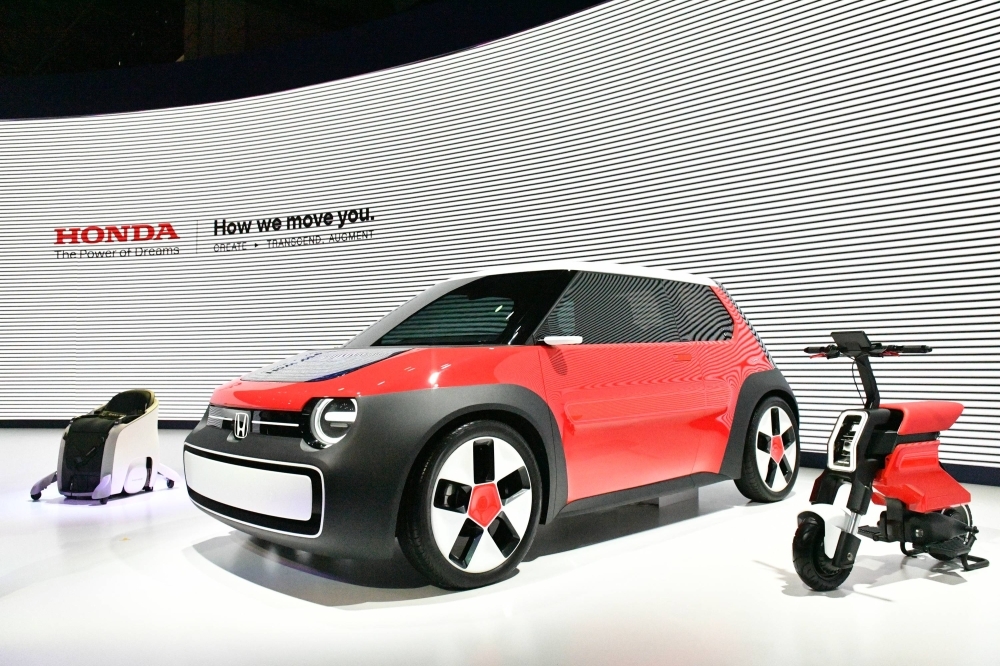 Honda displays its mobility products at the Japan Mobility Show on Wednesday. One of its personal mobility devices looks like a chair, with users able to control it while sitting. Honda displays its mobility products at the Japan Mobility Show on Wednesday. One of its personal mobility devices looks like a chair, with users able to control it while sitting.