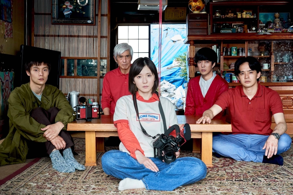 A fledgling film director (Mayu Matsuoka, center) returns home to make a film about her dysfunctional family in “Masked Hearts.”