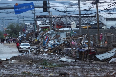 Street stalls damaged by Hurricane Otis near the entrance to Acapulco, Mexico, on Wednesday