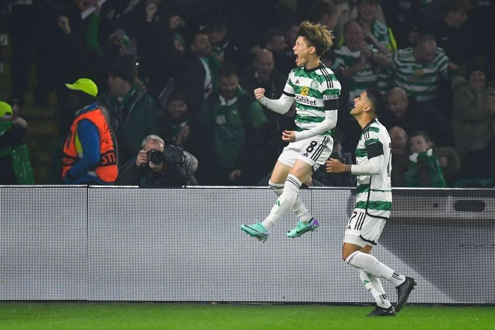 Celtic's Kyogo Furuhashi celebrates after scoring against Atletico Madrid in their Champions League group match in Glasgow, Scotland, on Wednesday. 