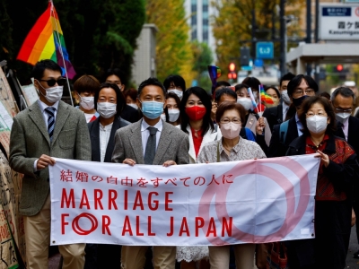 Plaintiffs, lawyers and supporters march to the Tokyo District Court on Nov. 30, the same day the court ruled that Japan’s lack of legal protections for same-sex couples is unconstitutional.