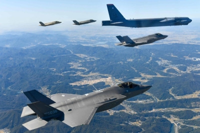 A U.S. Air Force B-52 strategic bomber is escorted by South Korean F-35s during a joint military exercise over the Korean Peninsula that also involved Japan's Air-Self Defense Force.