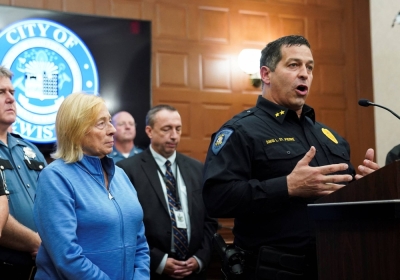 Lewiston Chief of Police David St. Pierre speaks as Maine Gov. Janet Mills looks on during a news conference after mass shooting suspect Robert Card was found dead on Friday. 