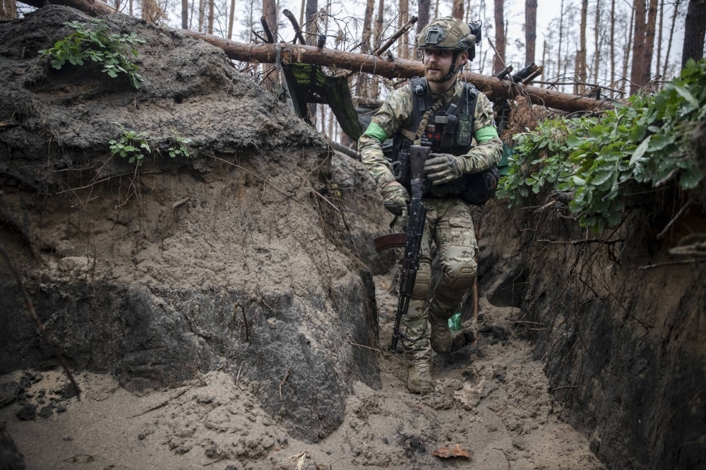 A Ukrainian soldier in a trench in a front-line position near Lyman in the Donetsk Region of eastern Ukraine on Friday. 