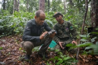 Pablo Sinovas, country director for Fauna & Flora in Cambodia, sets a camera trap in Virachey National Park, alongside Ministry of Environment ranger Churt Thom. | Anton L. Delgado
