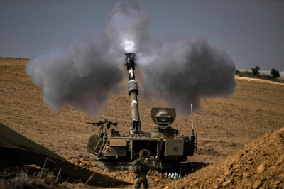 The Israeli military fires shells toward the Gaza Strip on Saturday.