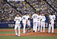 Orix Buffaloes ace Yoshinobu Yamamoto (18) walks off the mound after being pulled in the sixth inning of Game 1 of the Japan Series on Saturday at Kyocera Dome Osaka.  | Kyodo 