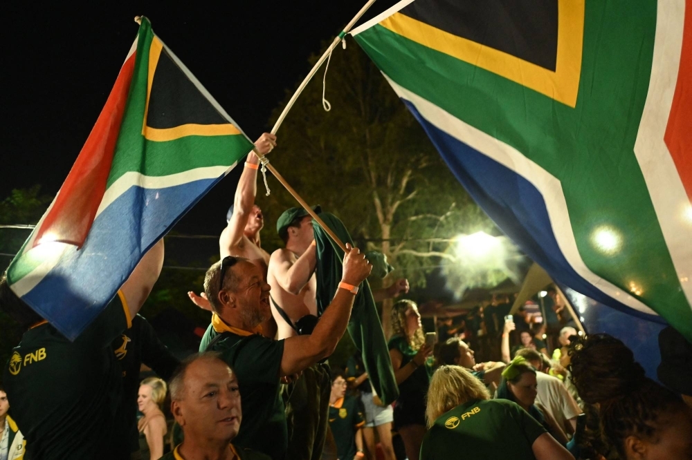 South African rugby supporters celebrate the team's World Cup triumph, in Johannesburg on Saturday. 