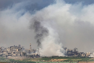 Smoke rises from northern Gaza after an Israeli airstrike, seen from Sderot, Israel, on Sunday.