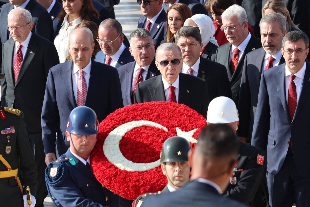 Turkish President Recep Tayyip Erdogan (center) and state officials visit Anitkabir, mausoleum of Turkish Republic's Founder Mustafa Kemal Ataturk, to mark the 100th anniversary of the Turkish Republic in Ankara on Sunday.
