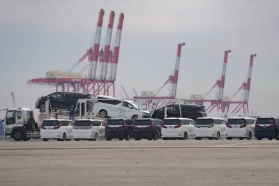 Toyota's Alphard and Vellfire minivans bound for shipment at Yokohama port. Toyota posted record global production and sales in the April-September period.