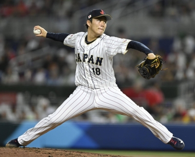 Yoshinobu Yamamoto pitches in Japan's World Baseball Classic semifinal game against Mexico at loanDepot park in Miami on March 20.