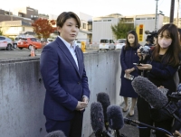 Rina Gonoi, who made the rare move of coming forward over alleged sexual offenses she suffered while serving as a Ground Self-Defense Forces member, speaks to reporters outside the Fukushima District Court on Monday. | Kyodo