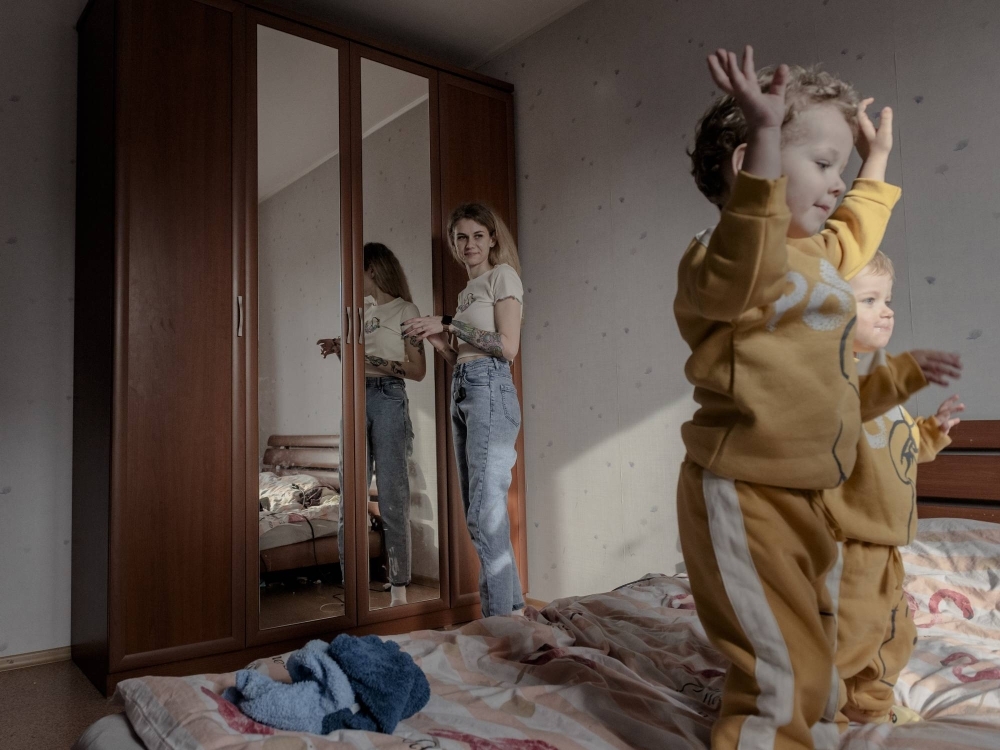 Maryna Bodnar, 24, with her children, Matviy and Gennady, at home in Chernihiv, Ukraine, on April 11, 2023. 'I don’t feel strong,' Bodnar said. 'But I am looking for strength to continue.' 
