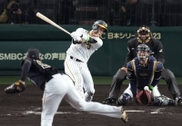 Udagawa strikes out Kinami, the Tigers' hottest hitter, on Tuesday.  | Kyodo 