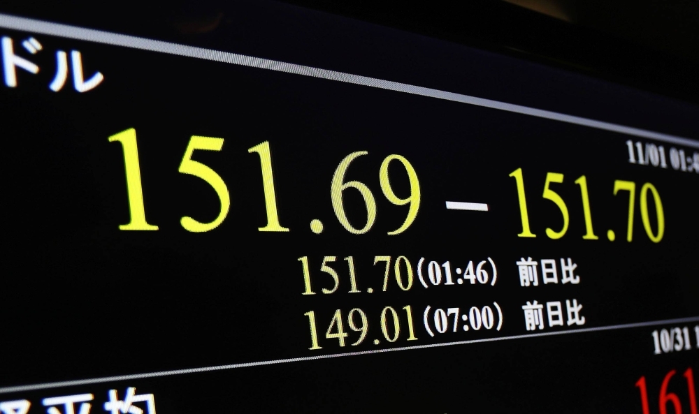 A monitor in Tokyo shows the yen weakening below ¥151 to the dollar on Wednesday.