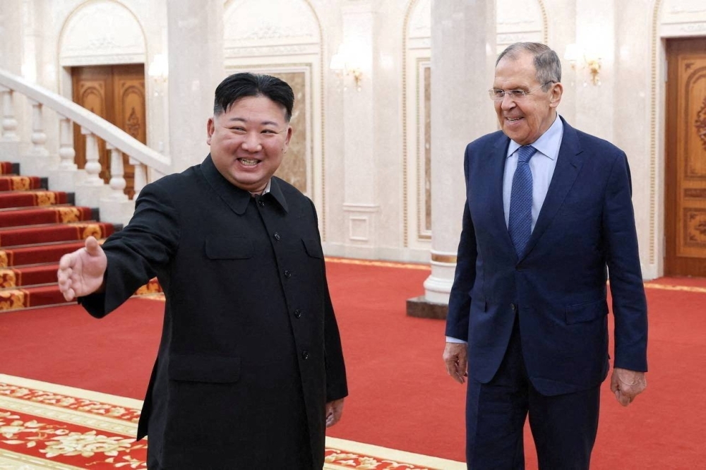 North Korean leader Kim Jong Un welcomes Russian Foreign Minister Sergey Lavrov during a meeting in Pyongyang on Oct. 19.