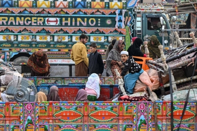 Afghan refugees arrive in a truck at a holding center as they prepare to depart for Afghanistan, in the town of Landi Kotal, Pakistan, on Wednesday. Hundreds of thousands of Afghans living in Pakistan faced the threat of detention and deportation on the day, as a government deadline for them to leave sparked a mass exodus.