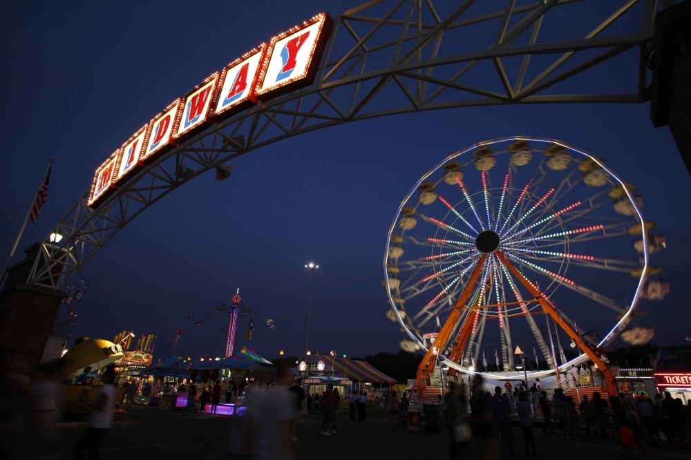 The midway in Springfield, Massachusetts, lit up at night. Framingham, Massachusetts mayor Charlie Sisitsky said its geothermal pilot project could more than halve emissions and cut energy consumption for some properties by up to 70%.