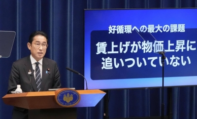 Prime Minister Fumio Kishida holds a news conference about a new economic stimulus package in Tokyo on Thursday.