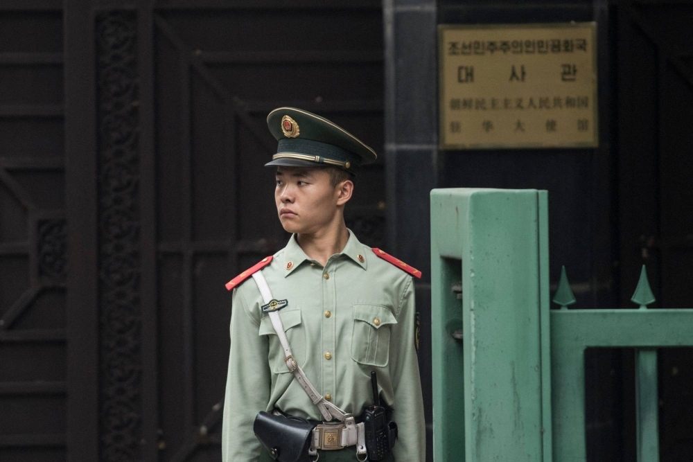 A Chinese paramilitary guard stands at the North Korean Embassy in Beijing in September 2017. 