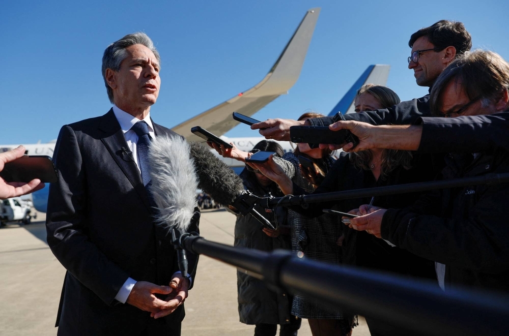 U.S. Secretary of State Antony Blinken speaks to reporters before leaving Washington on Thursday for a diplomatic trip to the Middle East and Asia.