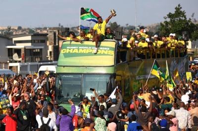 South Africa players celebrate winning the Rugby World Cup as their trophy tour passes through Soweto on Thursday.