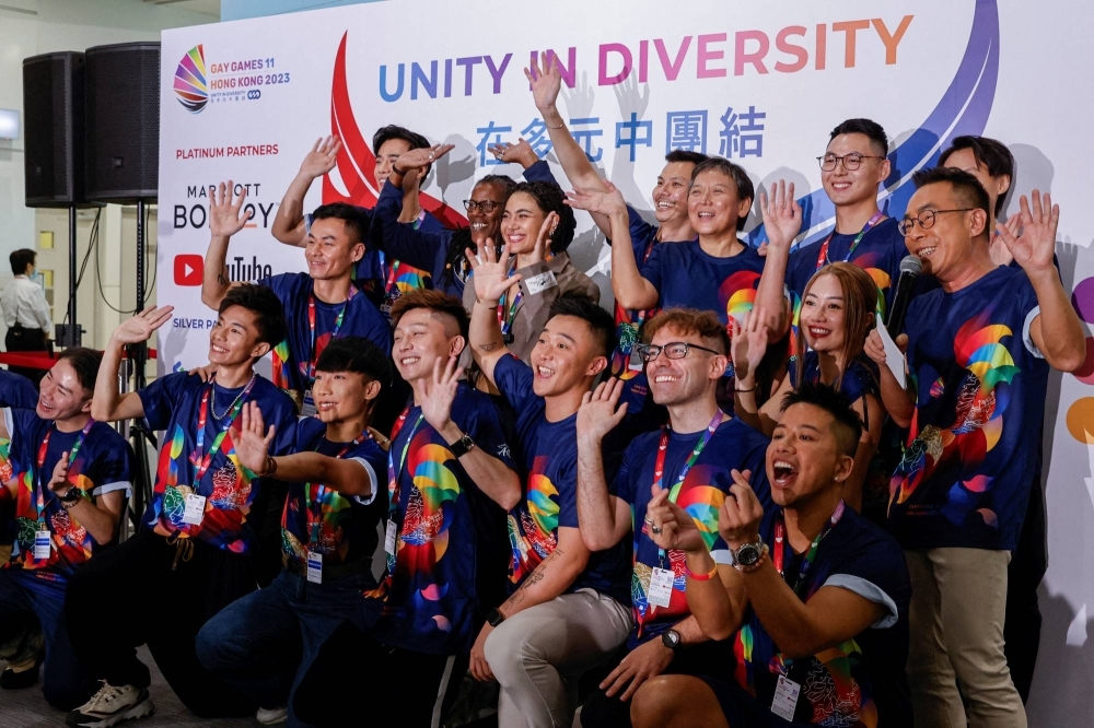Participants pose for photos at a news conference ahead of the Gay Games in Hong Kong on Thursday.