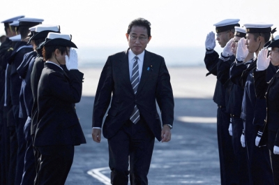 Prime Minister Fumio Kishida is saluted by Maritime Self-Defense Force members during the International Fleet Review to commemorate the 70th anniversary of the foundation of the MSDF, at Sagami Bay, off Yokosuka, on Nov. 6, 2022.