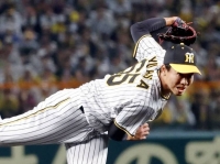 Tigers reliever Atsuki Yuasa needed just one pitch to make a major impact in Game 4 of the Japan Series. | KYODO
