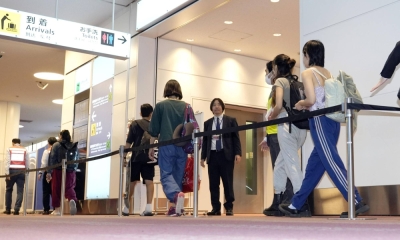 Japanese evacuees from Israel arrive at Tokyo's Haneda Airport via an Air Self-Defense Force flight on Friday night.