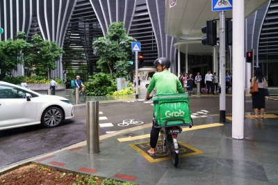 A Grab food delivery cyclist makes a delivery in Singapore on Aug. 21.