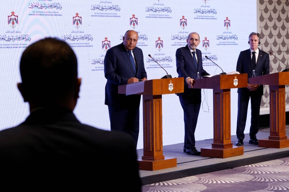 U.S. Secretary of State Antony Blinken, Egyptian Foreign Minister Sameh Shoukry and Jordanian Deputy Prime Minister and Foreign Minister Ayman Safadi hold a news conference after meetings about the ongoing conflict between Israel and the Palestinian Islamist group Hamas, in Amman on Saturday.