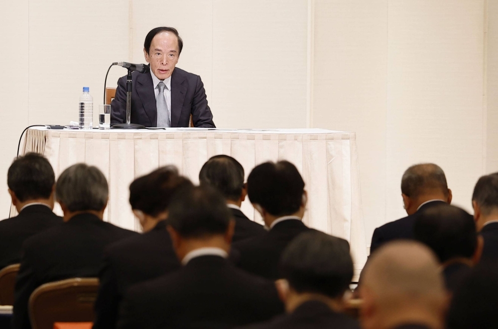 Bank of Japan Gov. Kazuo Ueda addresses business leaders in Nagoya on Monday.