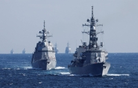 The Maritime Self-Defense Force's Takanami destroyers leads the MSDF fleet during the International Fleet Review to commemorate the 70th anniversary of the foundation of the force in Sagami Bay, off Yokosuka, Kanagawa Prefecture, in November last year. | POOL / VIA REUTERS