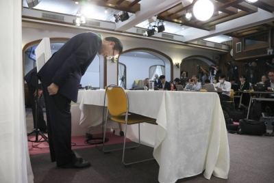 Tomihiro Tanaka, president of the Japan branch of the Unification Church also known as the Family Federation for World Peace and Unification, bows his head in apology during a news conference on Tuesday in Tokyo.