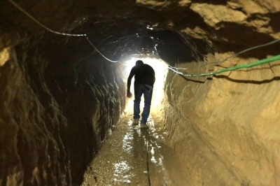 A Palestinian man walks in a tunnel linking the Gaza Strip to Egypt in 2012. The sprawling network of tunnels under the Gaza Strip has become a primary target for the Israeli military.