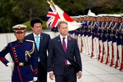 Defense Minister Minoru Kihara and British counterpart Grant Shapps review an honor guard ahead of a bilateral meeting at the Defense Ministry in Tokyo on Tuesday.