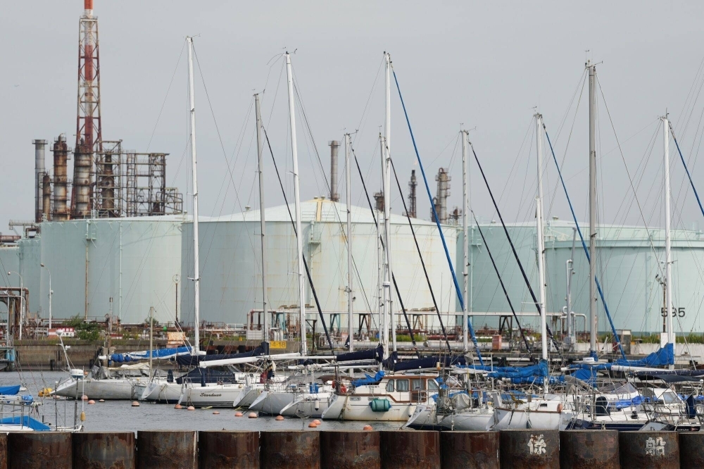 Oil storage tanks at Eneos' Negishi refinery in the Keihin industrial area of Yokohama. The firm said Wednesday that its full-year profit result was expected to increase by 67% from last year.