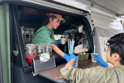 Coffee is served from a Toyota-developed fuel cell food truck at an event in Hita, Oita Prefecture, in October.