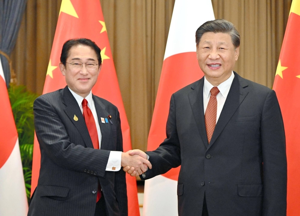Prime Minister Fumio Kishida and Chinese President Xi Jinping meet in Bangkok in November 2022. 