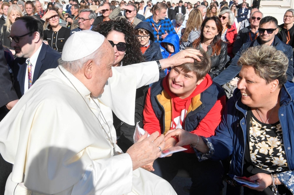 Pope Francis greets people during the weekly general audience in Saint Peter's Square at the Vatican on Wednesday.